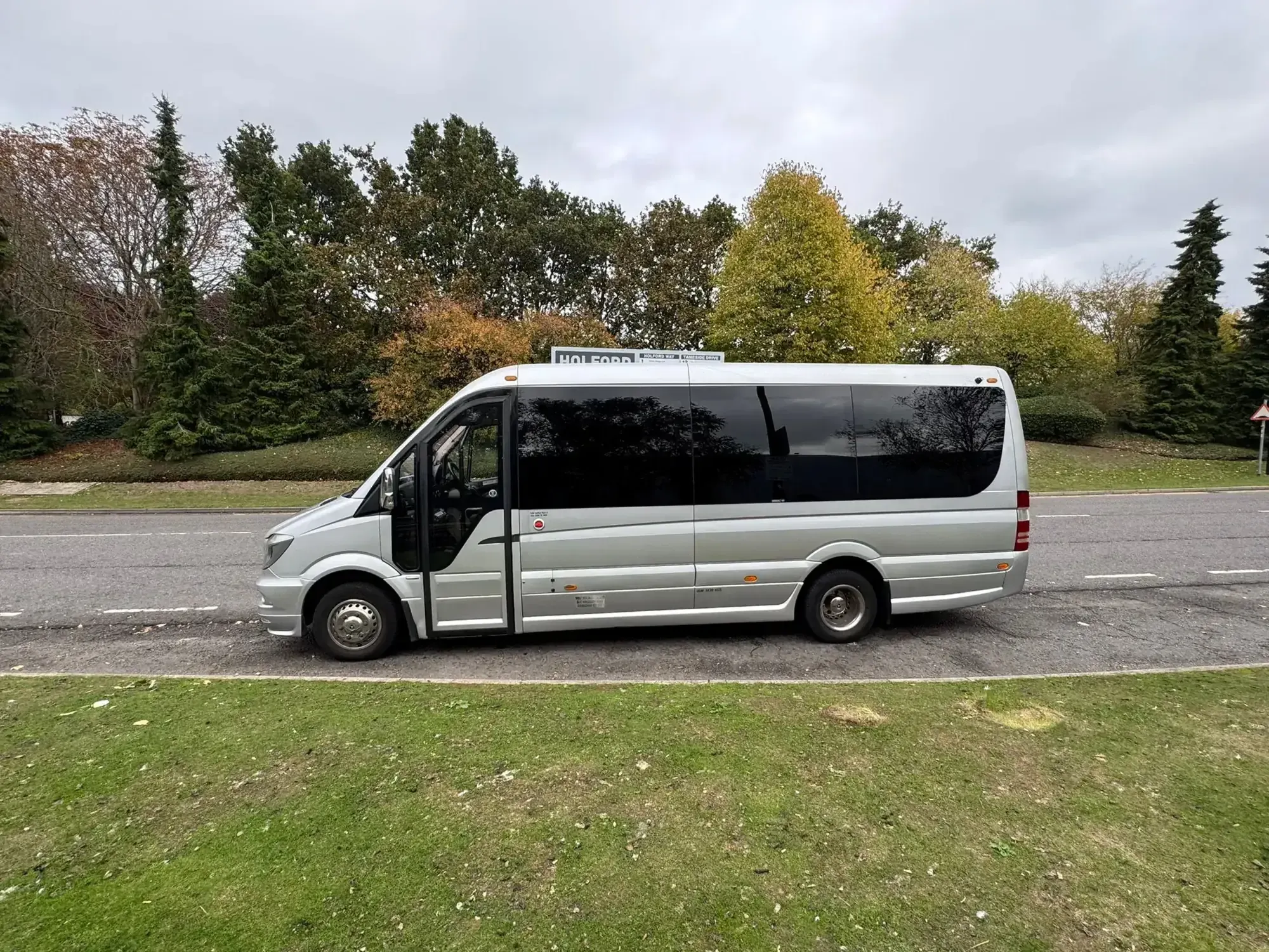 WMC minibus photographed from the side, parked at a roadside