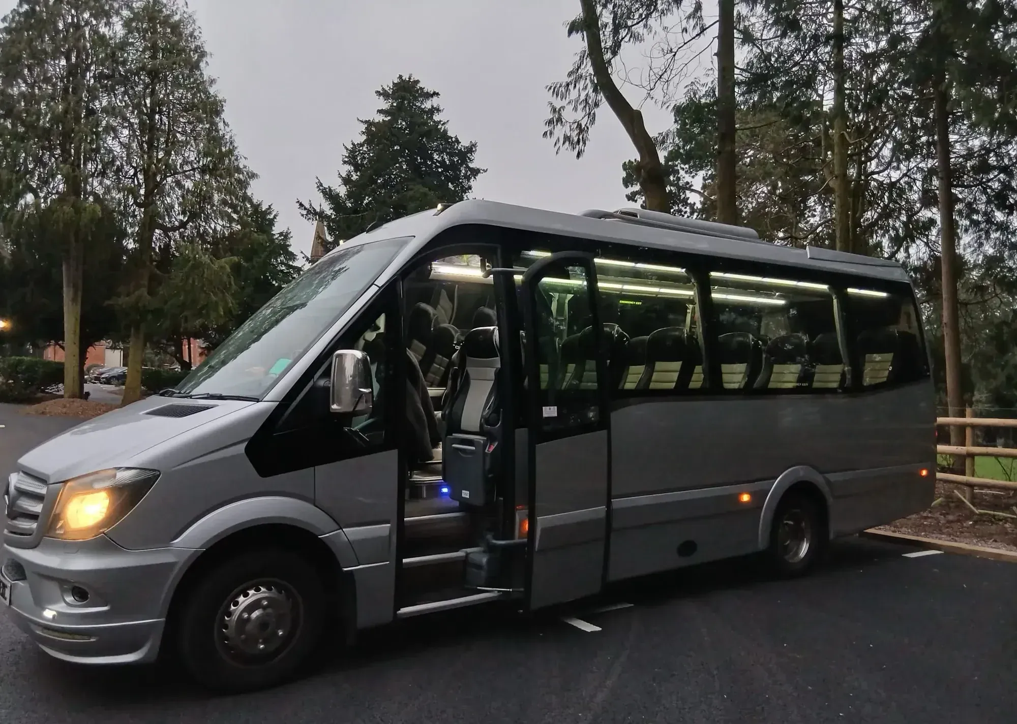 WMC minibus photographed from the front three-quarter view in a car park