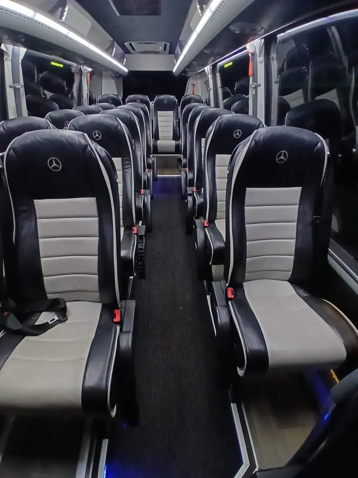 Interior seating view down the aisle of a supplied WMC minibus