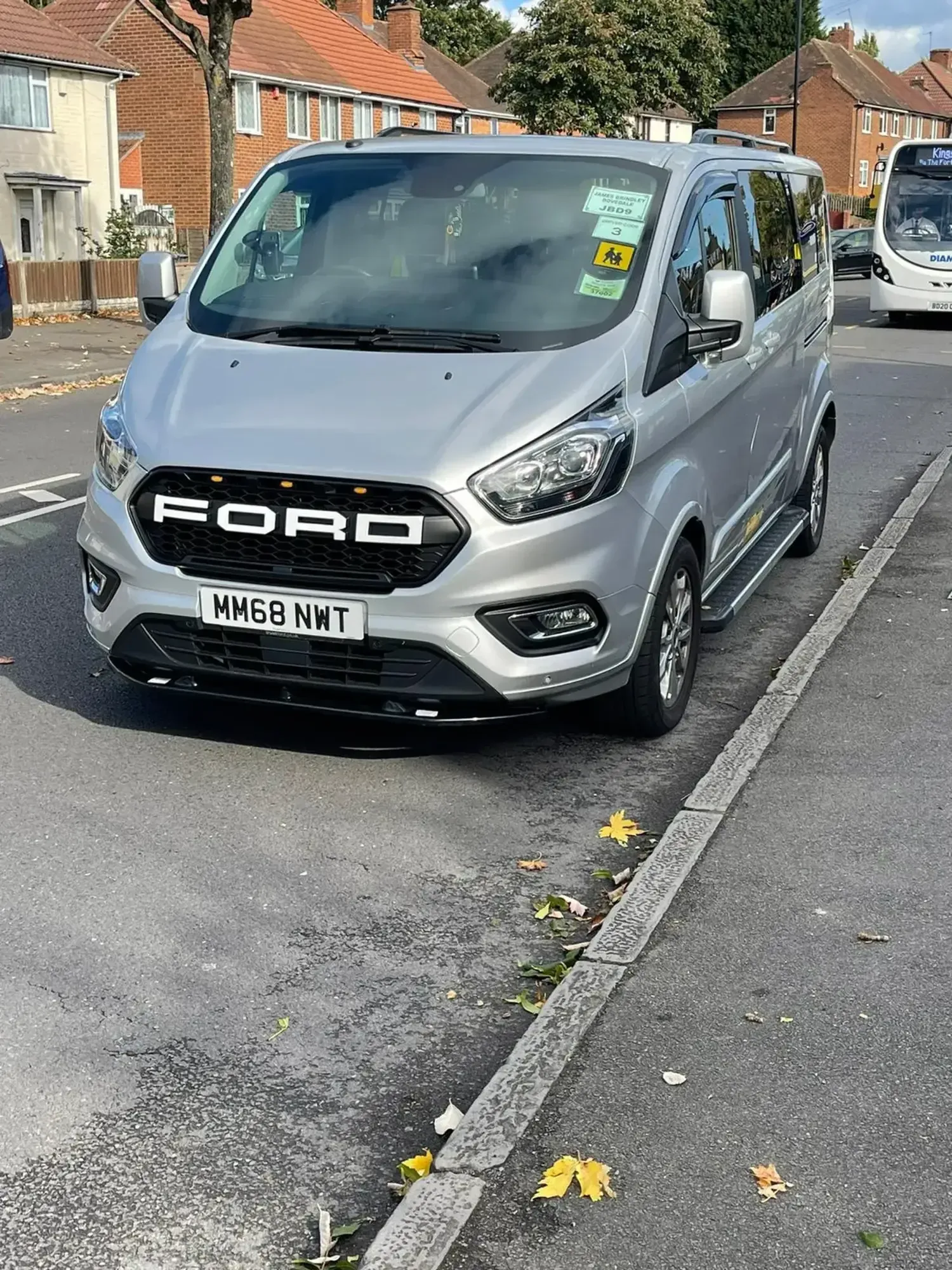 WMC minibus photographed from the front on a residential street